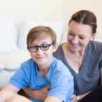 Child sitting smiling for photo