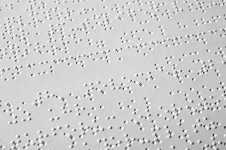 an image showing some english language braille sample on a white page