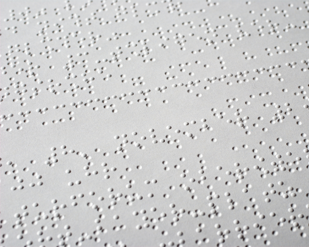 an image showing some english language braille sample on a white page