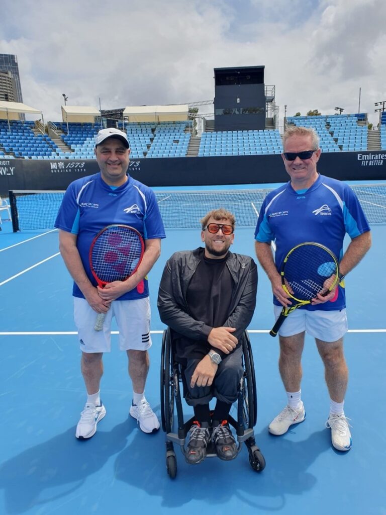 Adam Fayad, Blind Tennis Player, Dylan Alcott, Wheelchair Tennis athlete, Rob Fletcher, Blind Tennis player on a blue tennis court