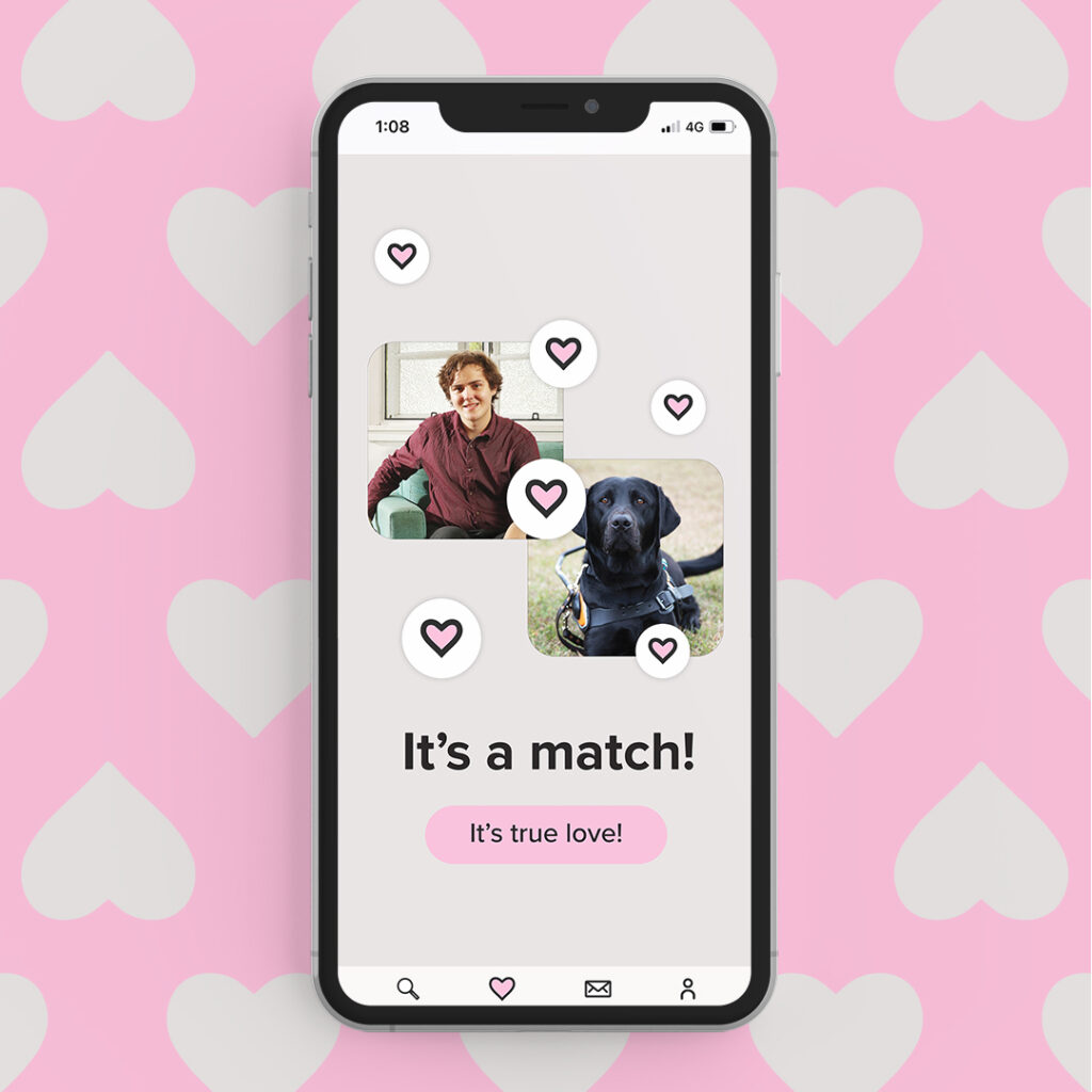 A phone showing the text "It's a match" with a picture of a person and their Guide Dog. Pink hearts surround them.