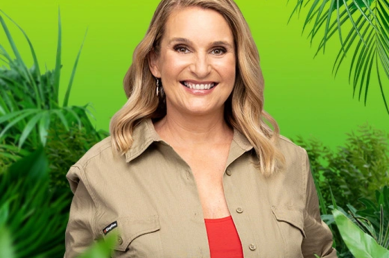Image Description 1: Reggie, wearing a red singlet and khaki shirt, smiles while standing in front of a green background with plants framing her.