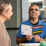 Guide Dog Client, Andrew recieving an accssible card.