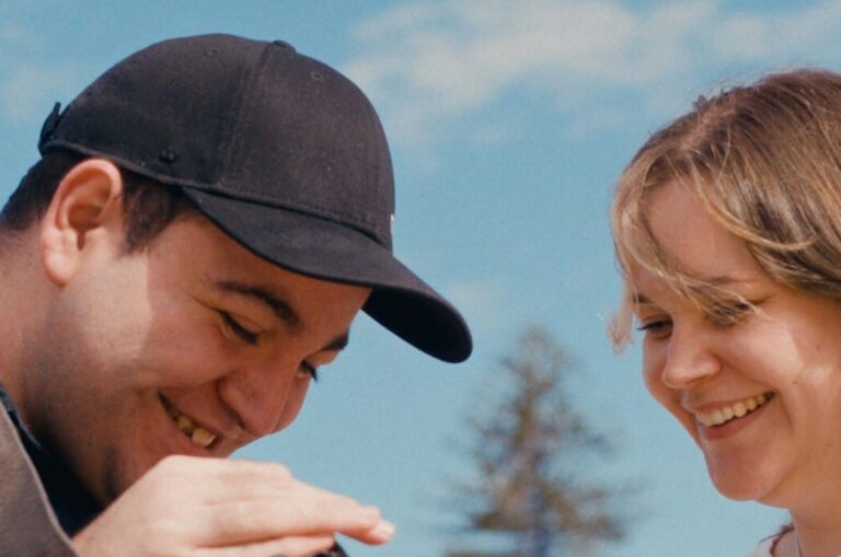 James and client look at camera