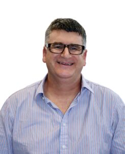 Headshot of Guide Dogs Victoria's Board Director, Anthony Kearns. Anthony is looking at the camera smiling.