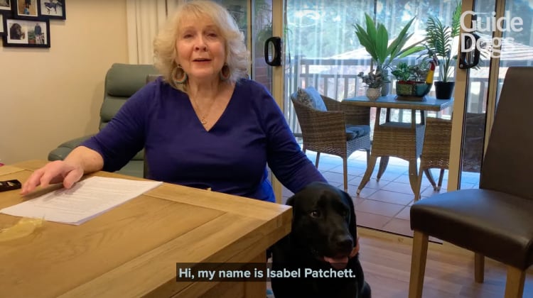 A YouTube Thumbnail showing Isabel Patchett and Galen the black Labrador