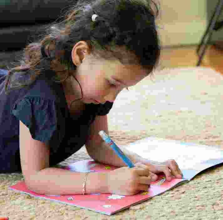a girl is drawing