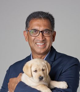 Headshot of GDV board member holding a labrador puppy.