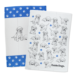Tea towel featuring illustrated Labradors.