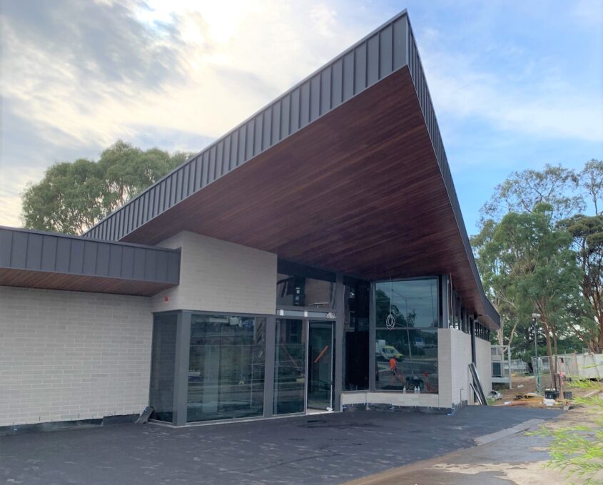 Facade of a building with a cantilevered roof.
