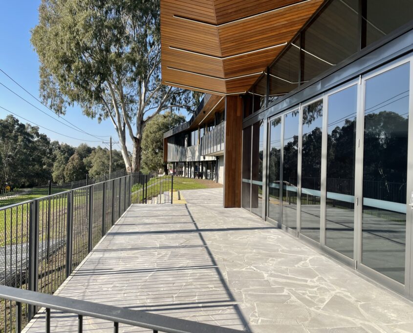 An outdoor space adjoined to a building.
