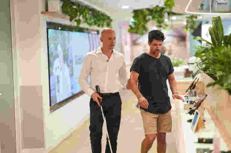 A Client being guided around their office.