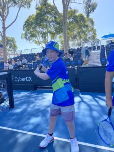 A child in a forehand pose.