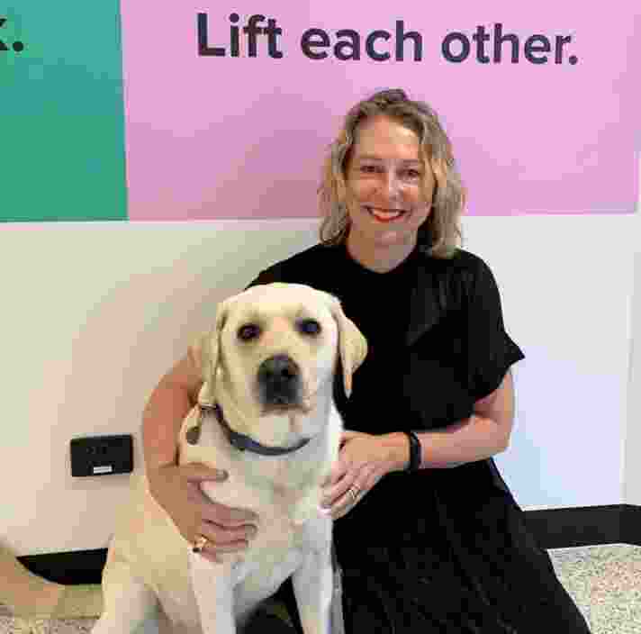 Kristy Richards with a guide dog