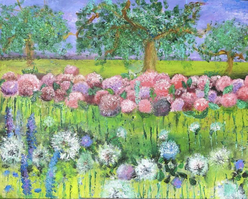 A vibrant garden scene with clusters of white, purple, and blue flowers in the foreground, pink and purple hydrangeas in the middle, and three large green trees against a bright blue sky in the background.