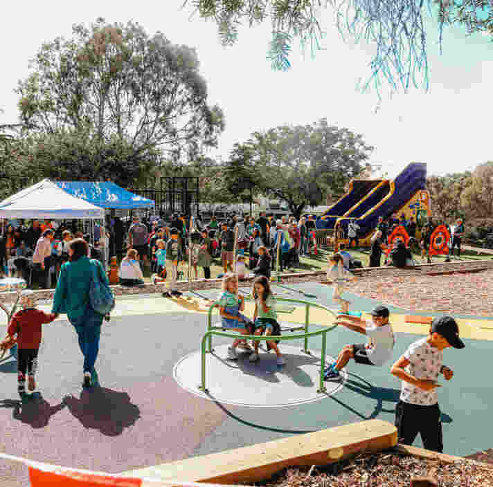Children playing in playground during Guide Dogs community fair