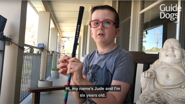 A YouTube Thumbnail of a young boy holding a cane