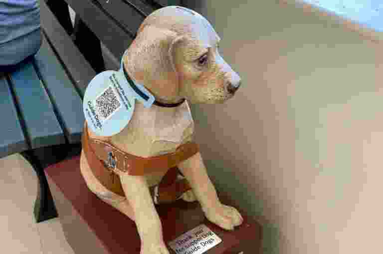 Statue of a Labrador with a QR Code.