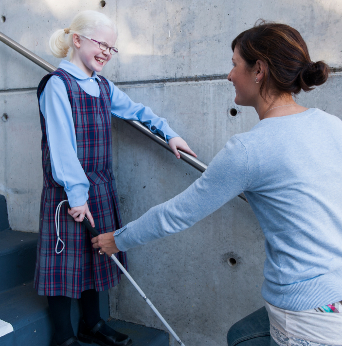 Jen is teaching Zara how to use a white cane on stairs