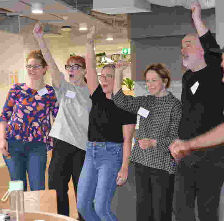 a group of people is celebrating after finishing the challenge