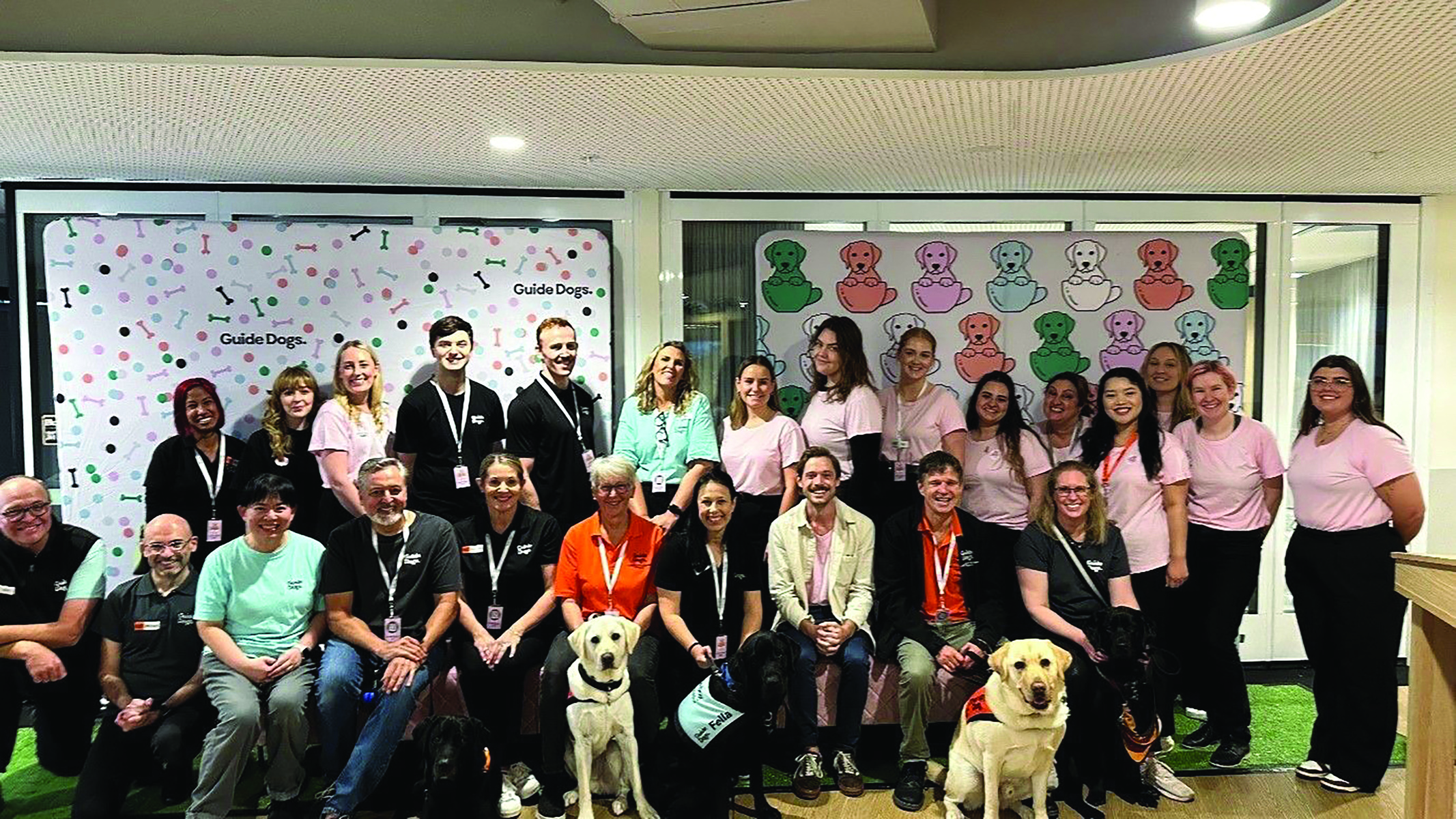 A group of about 25 people wearing Guide Dog t-shirts