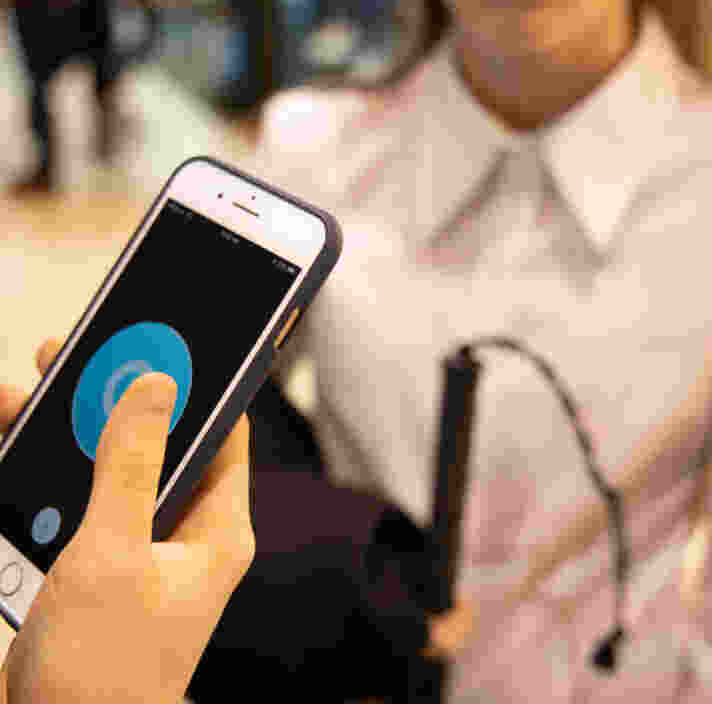 A person holding an iphone.
