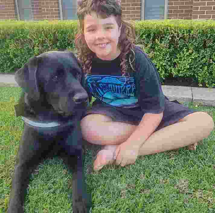 Benjamin and his black Labrador.