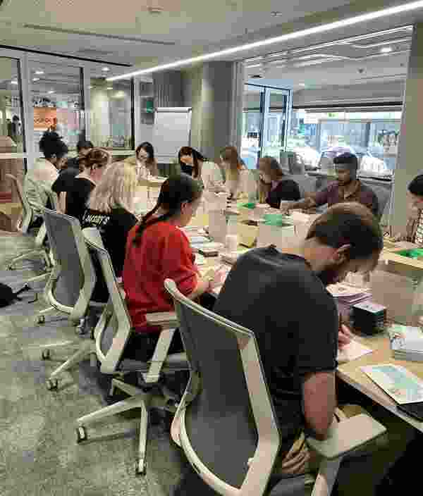 Volunteers packing in a boardroom.