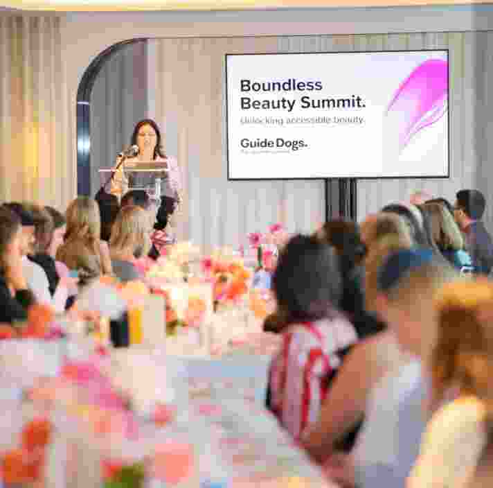 Nas Campanella speaking at the beauty summit event.