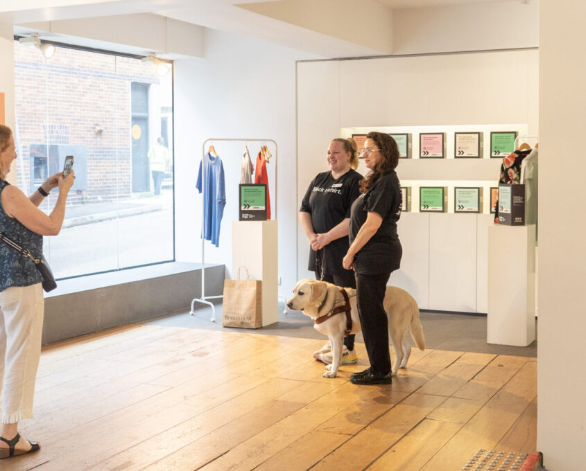 Two people standing and talking in the pop up.