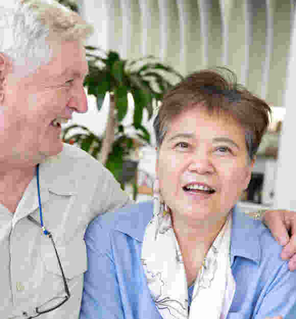 Two people laughing together,