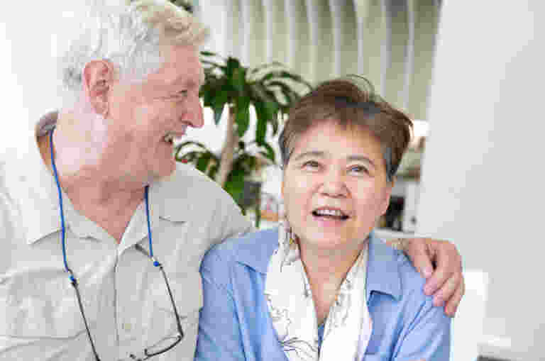 Two people laughing together,