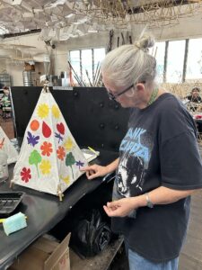Guide Dogs Client, Julie constructing the lantern.