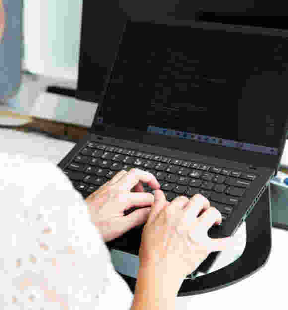 A person typing at a computer.