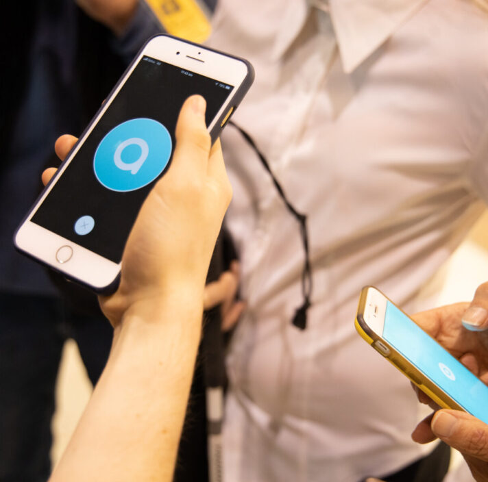 A person holding an iPhone.