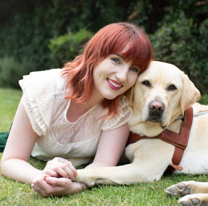 Ingrid and her Guide Dog Banner smiling at the camera.