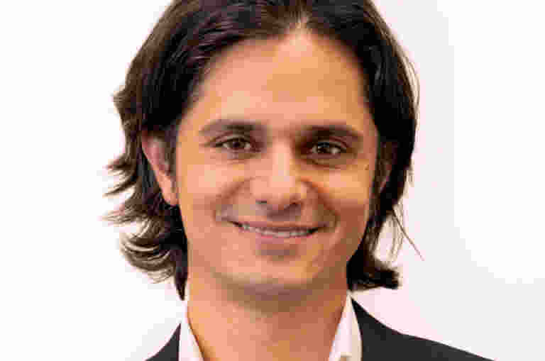 Ashley de Silva smiling at the camera.