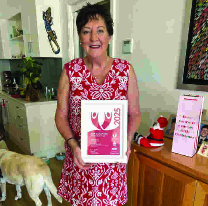 A woman holding a certificate