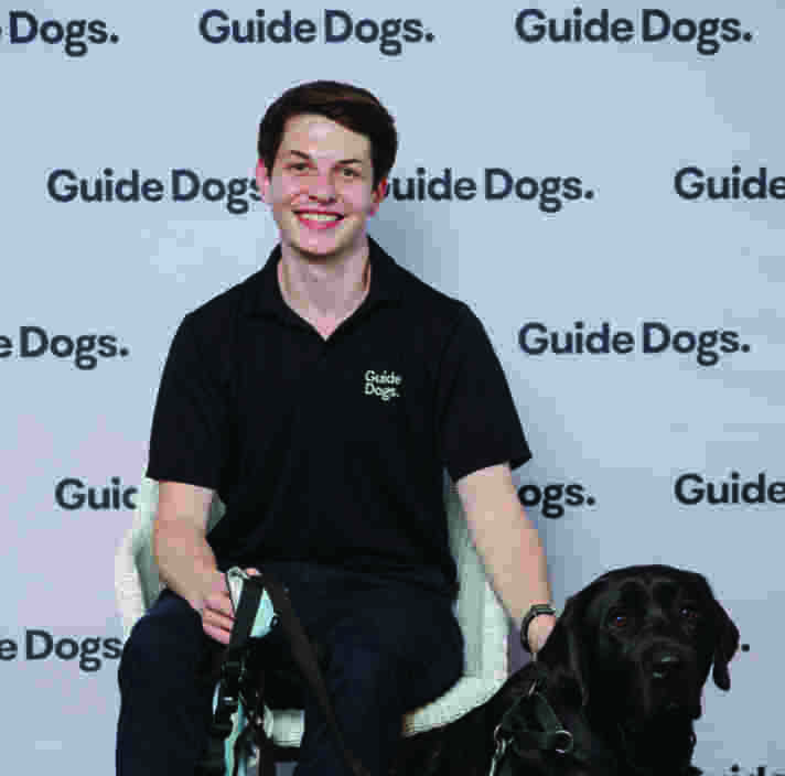 Tom with a black Labrador