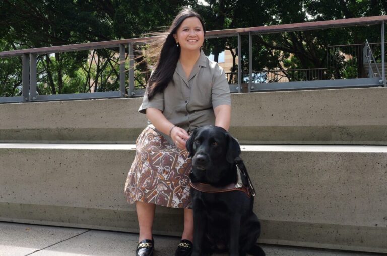 Big paws to fill during the transition from her first to second Guide Dog: Ria and Guide Dog, Trinity.