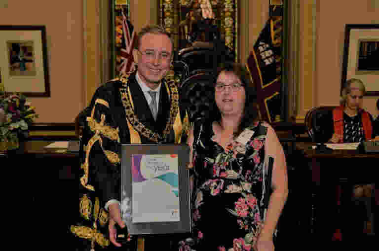 Chelsea is presented with her award by Lord Mayor Martin Haese