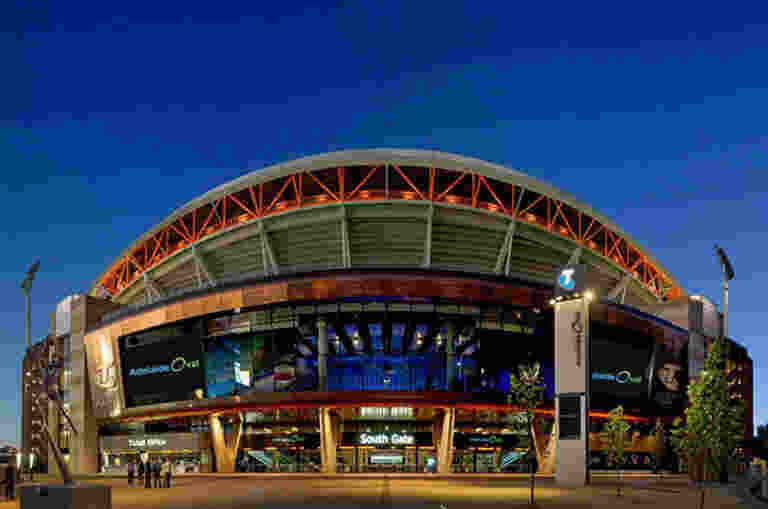 The view of an illuminated Adelaide Oval from the Southern Plaza