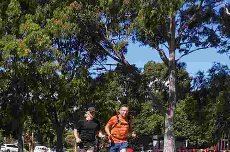 Client Warren and human guide Oscar running to prepare for a marathon.