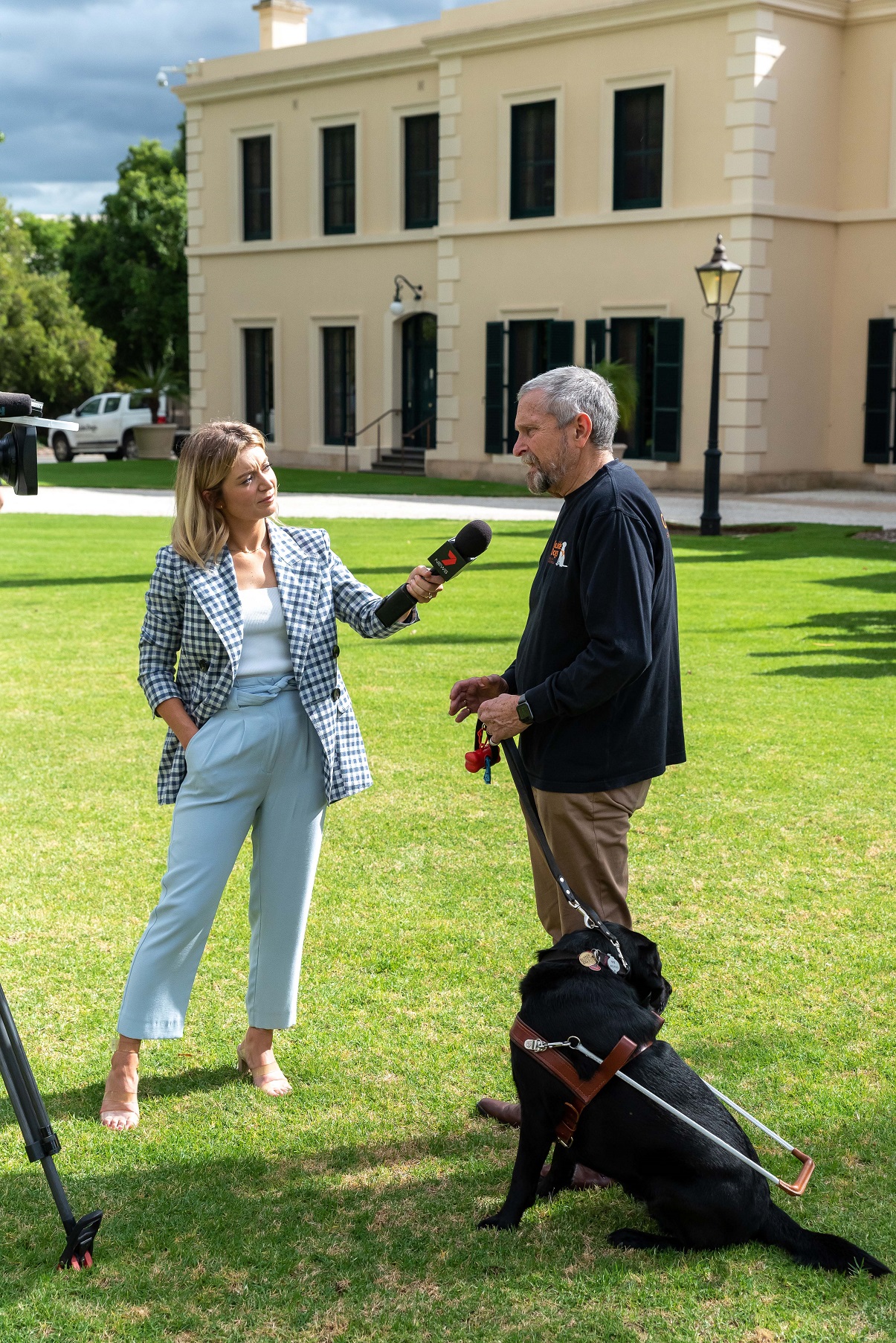 Bruce Ind and Guide Dog Oakland being interviewed by Channel 7 at Government House for International Guide Dog Day 2022.