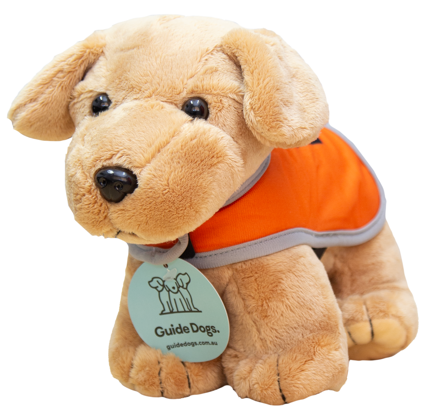 Plush toy guide dog wearing an orange vest and a tag labeled Guide Dogs.