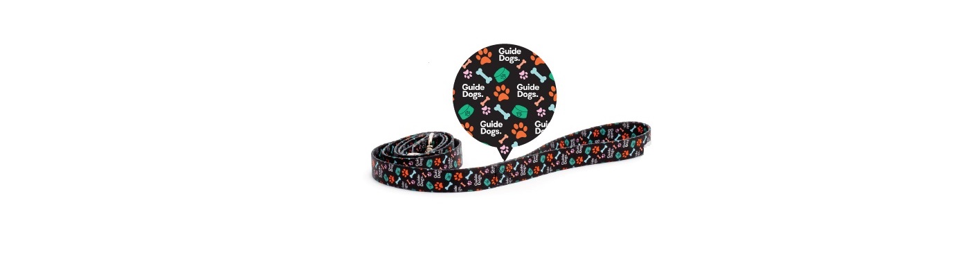 Dog Lead - Black with colorful paw prints and the words "Guide Dogs" on it.