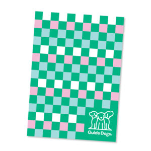 A tea towel featuring a checkered pattern of green, white, pink, and light blue squares with the Guide Dogs logo in the bottom right corner is included in the Tea Towel - Puppy Icons (2 Pack).