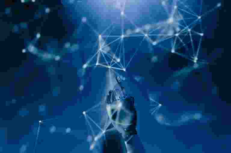 A robotic hand points towards abstract interconnected nodes and lines on a blue background, representing an AI network.