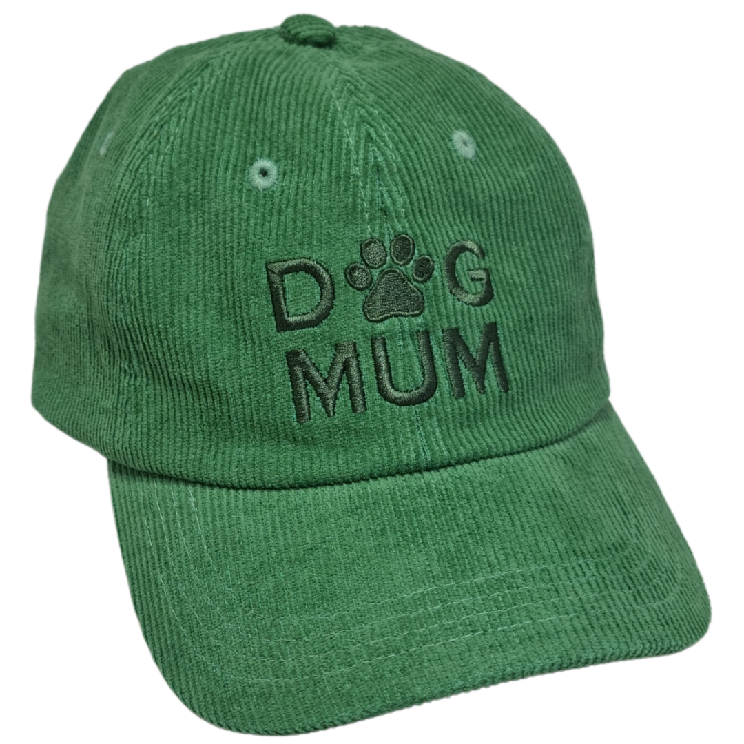 Green corduroy cap, with “DOG MUM” embroidered and a paw print between the D and G.