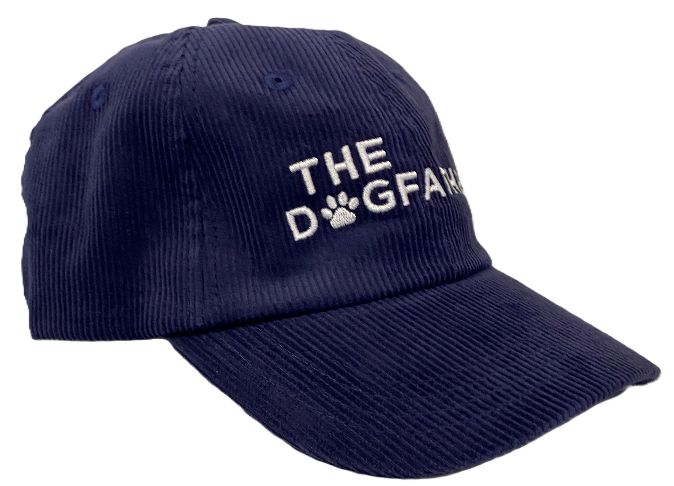 The Cap - Blue Corduroy is a navy blue corduroy baseball cap with THE DOGFANG embroidered in white on the front, where the letter O is replaced by a paw print.